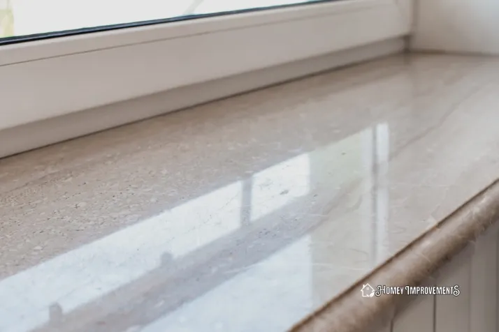 cleaning window sill with a toothbrush