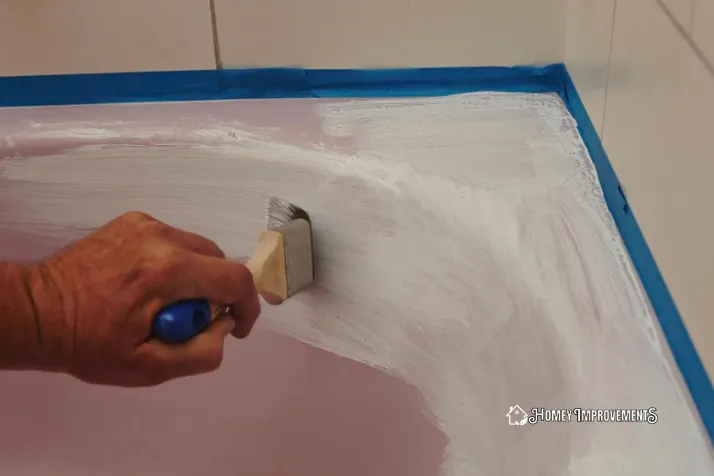 Applying the Paint on bathtub