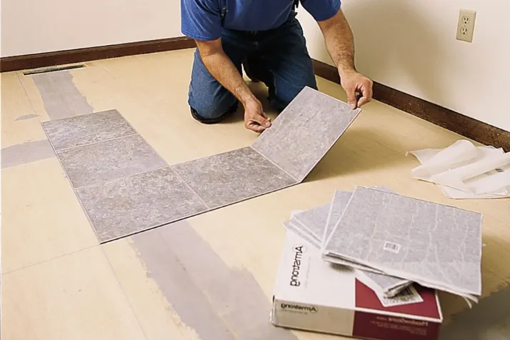 Pull out the Baseboards for laying peel and stick tile